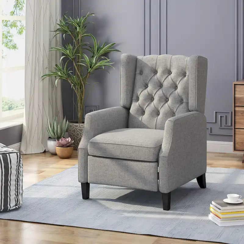 Fauteuil inclinable gris en tissu de style Mid-Century avec oreilles, mécanisme à poussoir, repose-pieds et dossier capitonné.