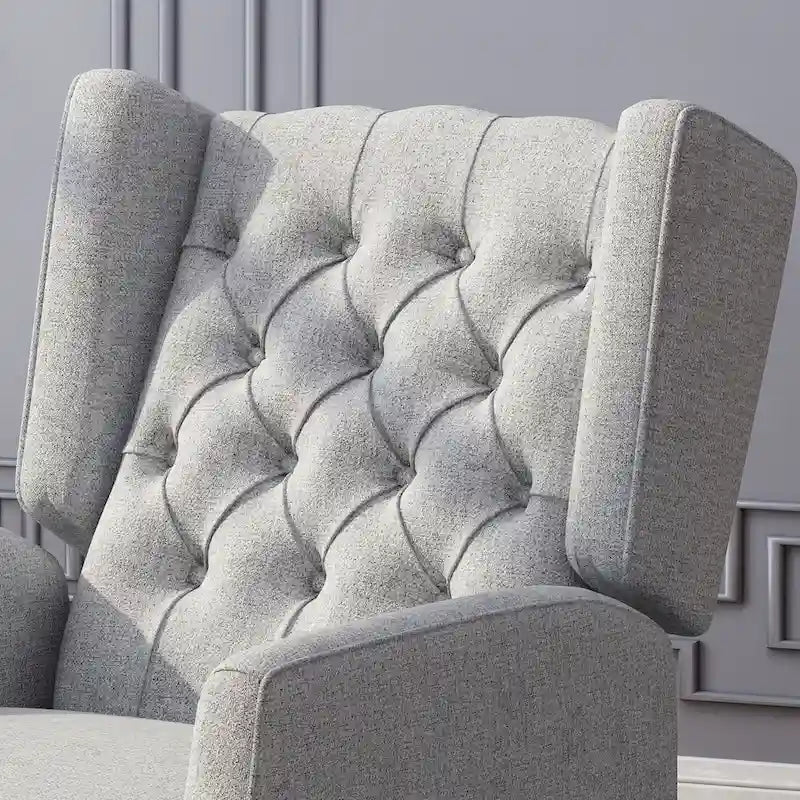 Fauteuil inclinable gris en tissu de style Mid-Century avec oreilles, mécanisme à poussoir, repose-pieds et dossier capitonné.