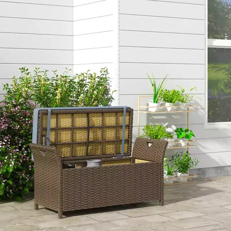 Banc de rangement en osier Outsunny 109 L, mobilier de jardin en rotin PE, pouf rectangulaire 2-en-1 avec poignées et coussin