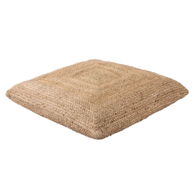 Le pouf/coussin de sol en jute texturé Faxon de Curated Nomad